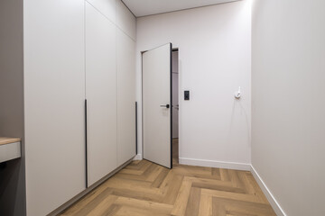long empty corridor in interior of entrance hall of modern apartments, office or clinic