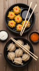 Delicious asian dumplings with dipping sauces and chopsticks on a wooden table