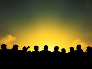 Fototapeta premium Silhouettes of athletes gather for a motivational huddle, success, competition