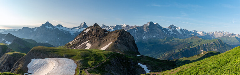 The most iconic mountain chain of the Swiss alps with mount Eiger, Jungfrau, Schreckhorn and Moench, mount Reeti in the foreground