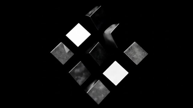 Abstract floating cubes in monochrome against black backdrop