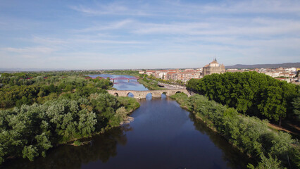 Fototapeta premium Drone Aerial View of Tagus River, Bridges, and Talavera de la Reina, Spain