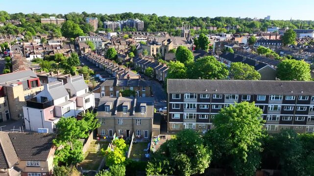 Aerial drone flyover cinematic video over iconic city of Greenwich built in Peninsula, London, United Kingdom