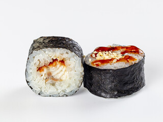 Unagi maki sushi rolls with teriyaki sauce and sesame seeds isolated on white background © Andrei Starostin