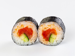 Two fresh salmon and cucumber maki sushi rolls isolated on a white background. © Andrei Starostin