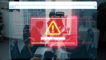 A group of business professionals discusses cybersecurity threats in an office setting while a red warning alert about a system hack appears on the screen. Raster © InfiniteFlow