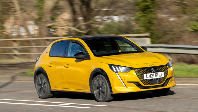 Milton Keynes,Bucks,UK - Feb 14th 2026: 2021 yellow Peugeot 208 gt yellow electric car driving on a British road