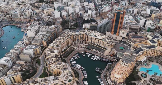Aerial view of the Portomaso Marina and surrounding buildings, a blend of modern architecture and serene harbor views, St. Julian's, Malta.