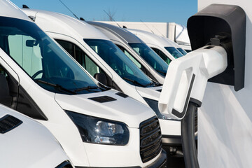 Electric delivery vans with electric vehicles charging station © scharfsinn86