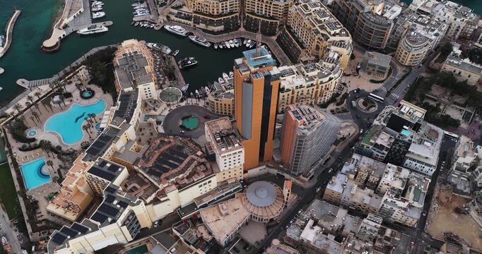 Aerial view of Portomaso and surrounding buildings, capturing the contrast of yachts in the marina and the architecture, St. Julian, Malta.