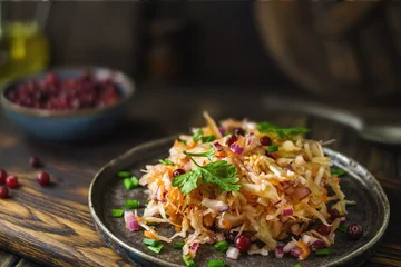 Enjoy vibrant plate of sauerkraut This traditional Eastern European fermented cabbage salad bursts with fresh herbs © Yingko
