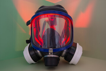 Exterminator&rsquo;s face mask with its filters, set in a colorful environment with colored lighting.