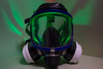 Exterminator&rsquo;s face mask with its filters, set in a colorful environment with colored lighting.
