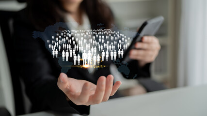 Fototapeta premium Businessperson using smartphone to connect with diverse people in virtual network, symbolizing communication, technology, and digital interaction in modern world Quark.
