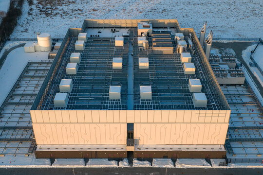 Aerial view of a data center with advanced cooling and ventilation systems on the roof. Digital technology infrastructure, Warszawa, Wojewodztwo mazowieckie, Poland.