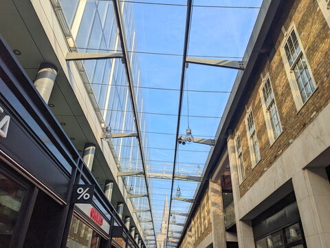 Architectural detail of the modern glass canopy at London's historic Old Spitalfields Market