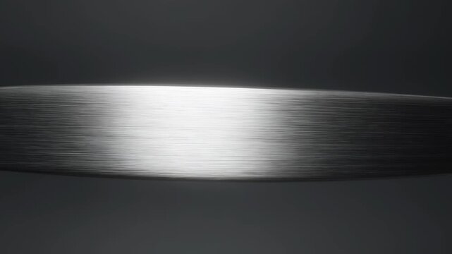 Sharp metal blade with bright edge against dark background - 4k video