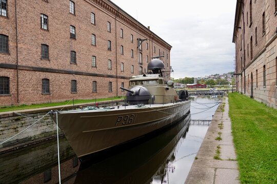 The deommissioned motor gun boat KNM Blink moored in a narrow canal at the navy musuem in Horten, Norway.