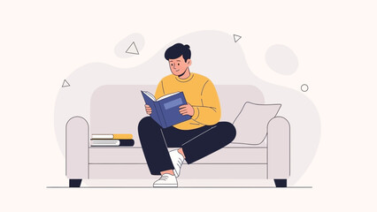 Fototapeta premium Young Man Reading a Book on a Sofa, Cozy Home Interior, Relaxing Lifestyle