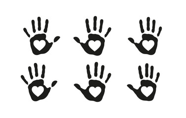 Fototapeta premium Black handprints with heart shapes inside on white background