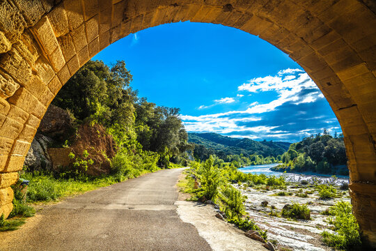 The arch of Pont du Gard ancient Roman aqueduct over the river of Gardon view