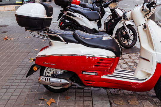 Barcelona, Spain&mdash;January 15, 2026. Red and white peugeot django scooter parked on street