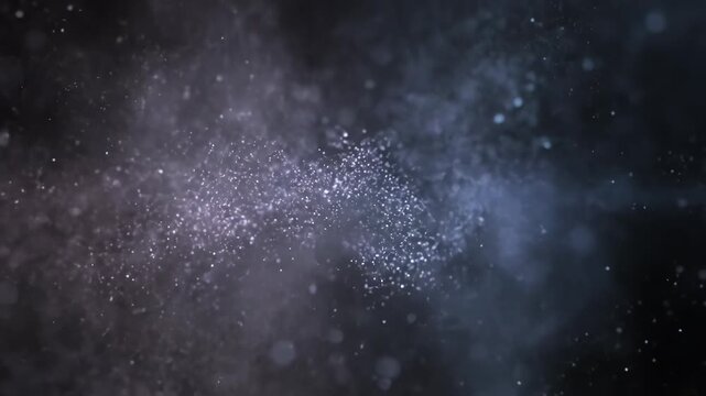 Sparkling dust particles drift through a dark, ethereal space. Gentle light illuminates the cosmic dance of tiny specks.