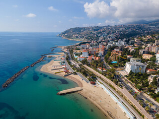 Fototapeta premium Sanremo aerial view at sunny day, beautiful Italian Riviera coastline with beach, turquoise sea and city architecture in Liguria, Italy