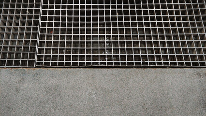 Water drain steel metal grid for underground flow with cement pavement
