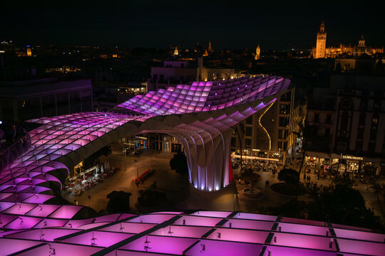 Seville, Spain - May 16, 2024: Evening View of Setas de Sevilla in Andalusia. Night Scenery of Colorful Metropol Parasol in the Andalusian City.