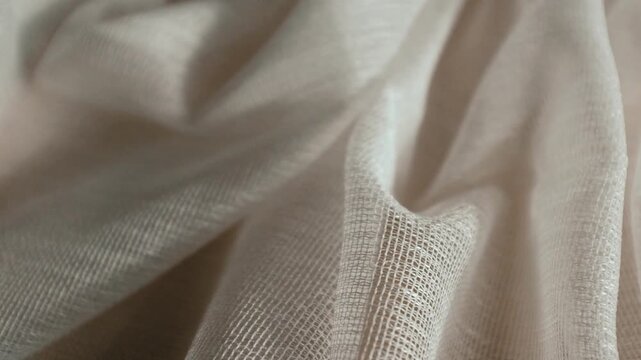 High-quality white loose texture cotton or linen fabric with a natural woven pattern. Ideal for themes of sustainable fashion, luxury bedding, home decor, and organic lifestyle.