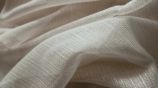 High-quality white loose texture cotton or linen fabric with a natural woven pattern. Ideal for themes of sustainable fashion, luxury bedding, home decor, and organic lifestyle.
