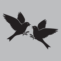 Obraz premium two birds flying face to face silhouette vector design art and illustration