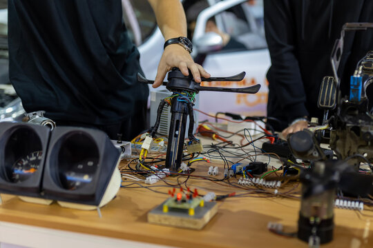 Hand assembling complex car electronic components wiring