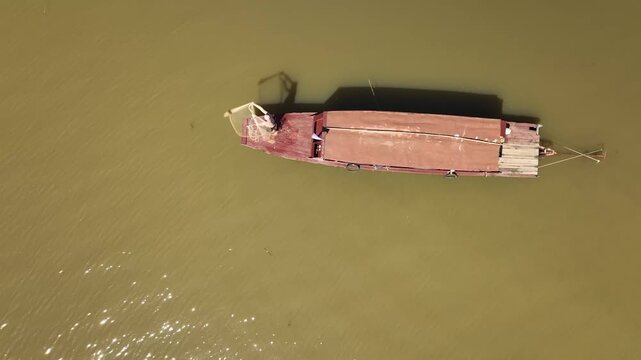Traditional fisherman casting net on Tonle Sap lake