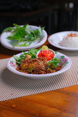 Delicious Indonesian dish with fresh herbs and rice