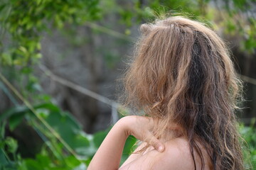 Woman with long hair on a green background,
