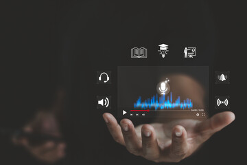Hand holding virtual podcast live streaming with microphone, sound wave and media icons. Concept of AI audio technology, online education, live streaming, training, digital learning, content creation.