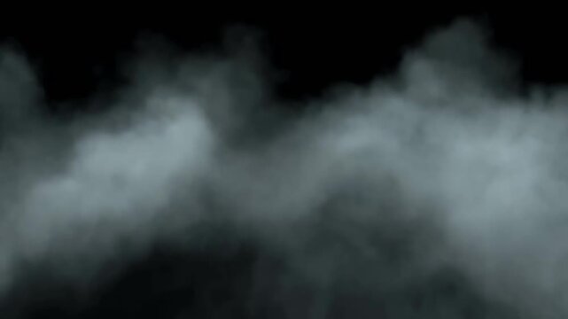 Low lying ground fog rolling across black background
