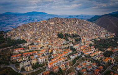 Obraz premium Sunset view of the rooftops of Gangi . Sicily, Italy. August 2024. Aerial drone picture.