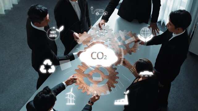 Business professionals engage in collaborative efforts focused on sustainability, showcasing strategies for achieving net zero emissions and reducing carbon footprints. Raster