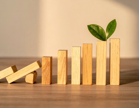 Overcoming setbacks concept with rising wooden blocks and green leaf