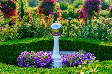 Gazing ball amid colourful greenery at Butchart Gardens, BC, Canada