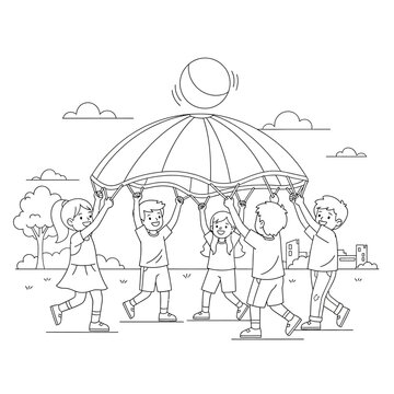 Children playing a parachute ball game outdoors in a park, a fun group activity for kids.