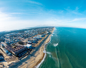 Kill Devil Hills, North Carolina, aerial view of the Atlantic coastline featuring sandy beaches, vacation homes, and the expansive Outer Banks landscape.