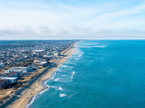 Kill Devil Hills, North Carolina, aerial view of the Atlantic coastline featuring sandy beaches, vacation homes, and the expansive Outer Banks landscape.
