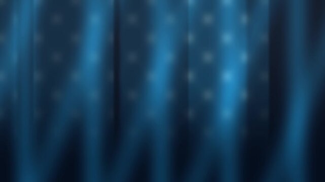 Polka-dotted blue fabric ripples softly in gentle light