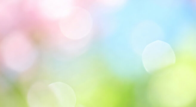 Blurred natural background with soft bokeh lights and pastel colors