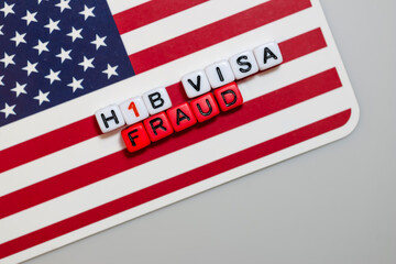 H1b visa fraud issue on united states flag with copy space
