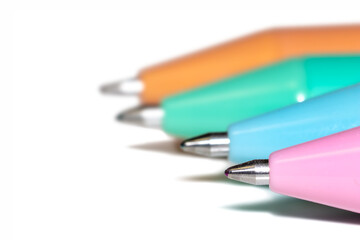 Colorful ballpoint pens lined up for writing and creativity with copy space